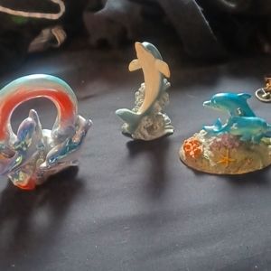 Glass dolphin figurines